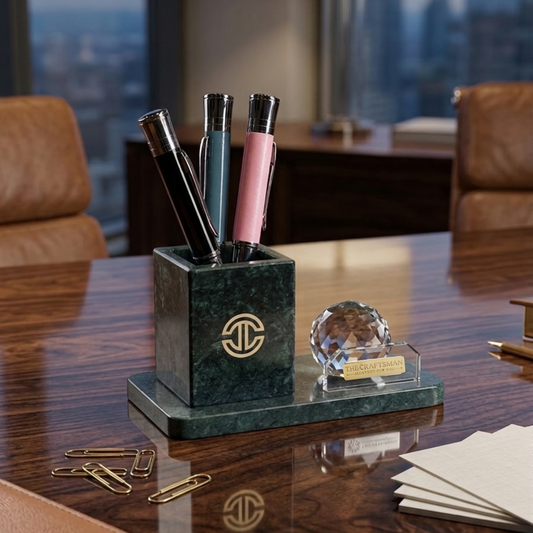Marble pen holder with pens and decorative items on a desk with a cityscape background