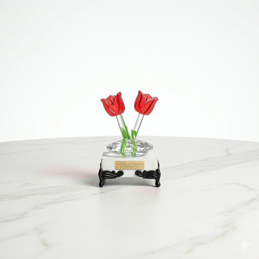 Marble base paper weight with two crystal tulip flowers with round clear glass stem growing from the marble with traditional legs