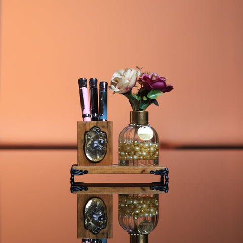 Artistic arrangement of bottles and flowers on a peach-colored background