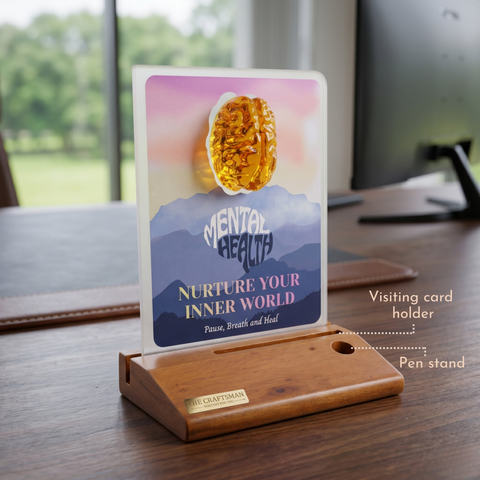 Wooden pen stand with a card holder displaying 'Mental Health: Nurture Your Inner World' on a desk.