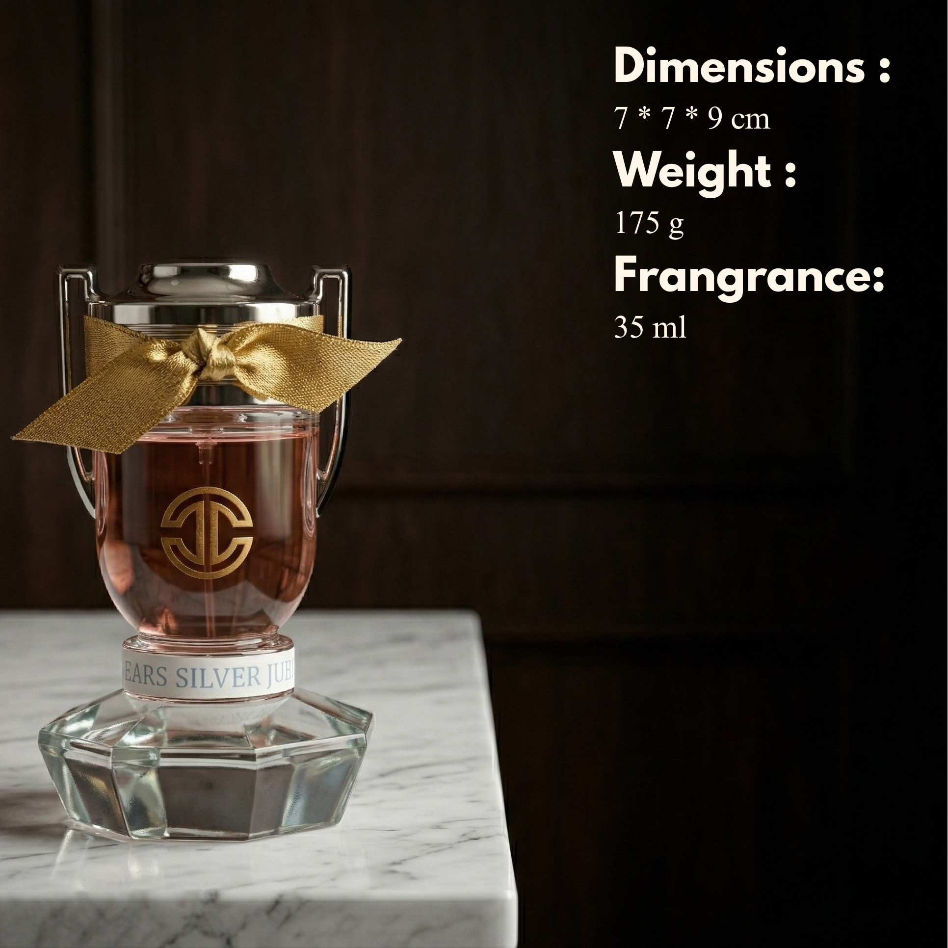 Perfume bottle with gold bow on a marble surface, dimensions, weight, and fragrance volume displayed.